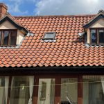Old roof tiles cleaned restored to red colour old farmhouse